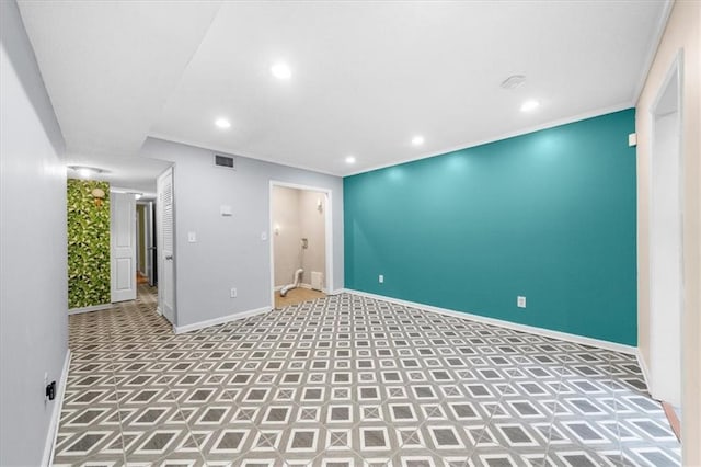 spare room featuring ornamental molding