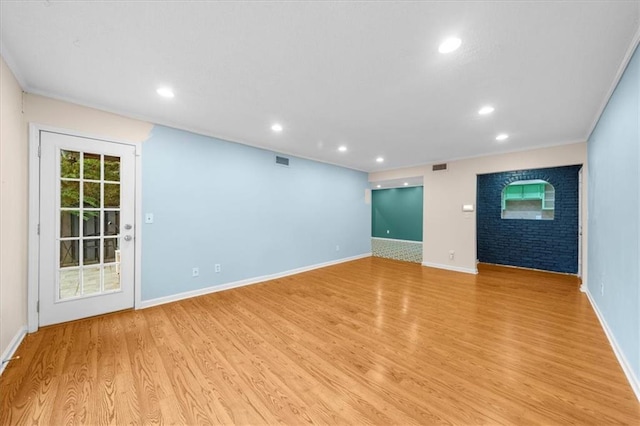 unfurnished living room with light hardwood / wood-style flooring