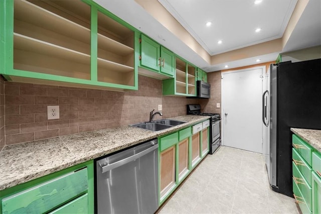 kitchen featuring green cabinets, crown molding, sink, appliances with stainless steel finishes, and light stone counters