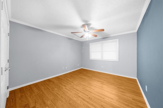 unfurnished room featuring ornamental molding, a textured ceiling, and light wood-type flooring