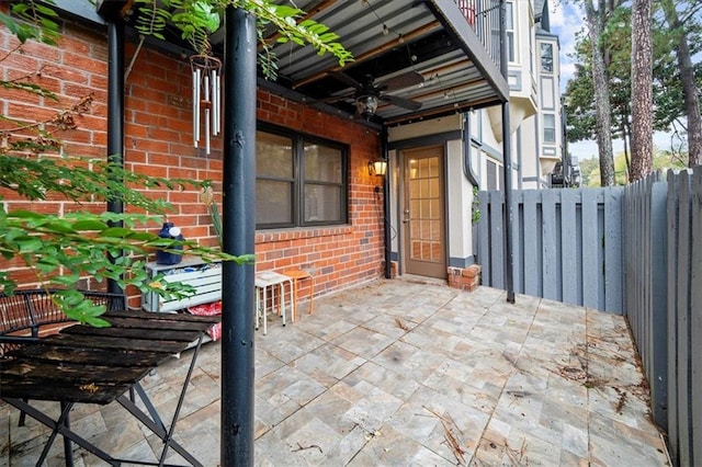 view of patio featuring ceiling fan