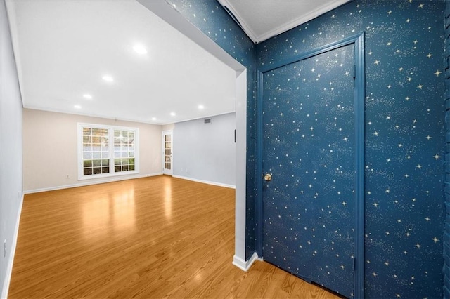 unfurnished living room with wood-type flooring