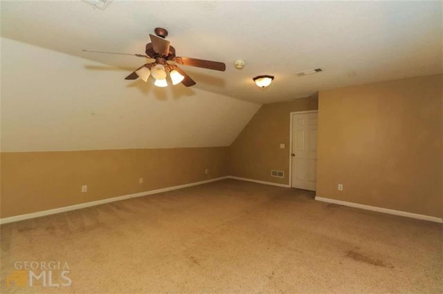 bonus room with carpet floors, lofted ceiling, ceiling fan, and baseboards