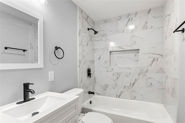 full bathroom featuring vanity, toilet, and tiled shower / bath combo