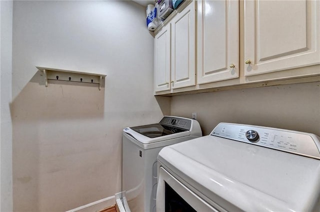1595 Chadberry Way, Lawrenceville, GA 30043 - laundry area with washer and clothes dryer, cabinet space, and baseboards