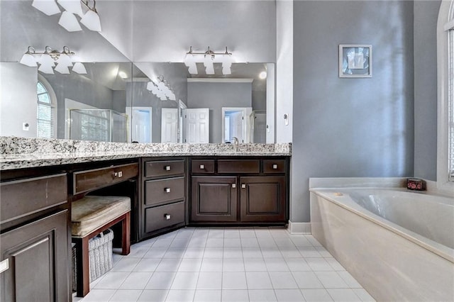 1595 Chadberry Way, Lawrenceville, GA 30043 - bathroom featuring tile patterned floors, a stall shower, a garden tub, and double vanity