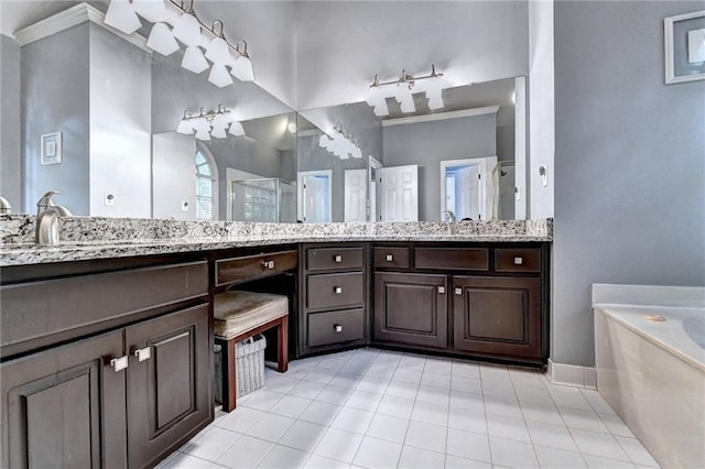 1595 Chadberry Way, Lawrenceville, GA 30043 - full bathroom featuring tile patterned floors, a shower stall, a garden tub, double vanity, and baseboards