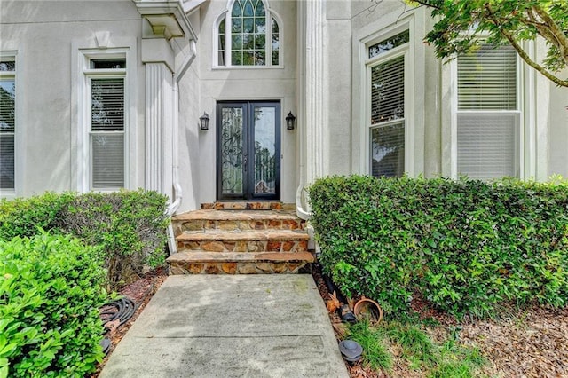 1595 Chadberry Way, Lawrenceville, GA 30043 - view of exterior entry featuring stucco siding and french doors