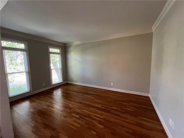 1595 Chadberry Way, Lawrenceville, GA 30043 - spare room featuring ornamental molding, dark wood-style flooring, and baseboards