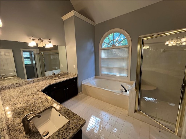 1595 Chadberry Way, Lawrenceville, GA 30043 - full bath featuring vaulted ceiling, a shower stall, a bath, double vanity, and tile patterned flooring