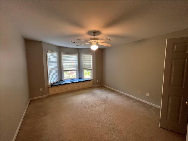 1595 Chadberry Way, Lawrenceville, GA 30043 - unfurnished room with ceiling fan, baseboards, and light colored carpet