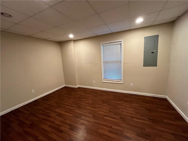 1595 Chadberry Way, Lawrenceville, GA 30043 - empty room featuring electric panel, wood finished floors, baseboards, a paneled ceiling, and recessed lighting