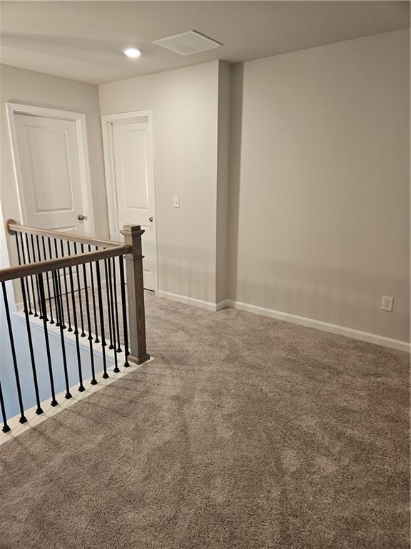 empty room featuring carpet flooring