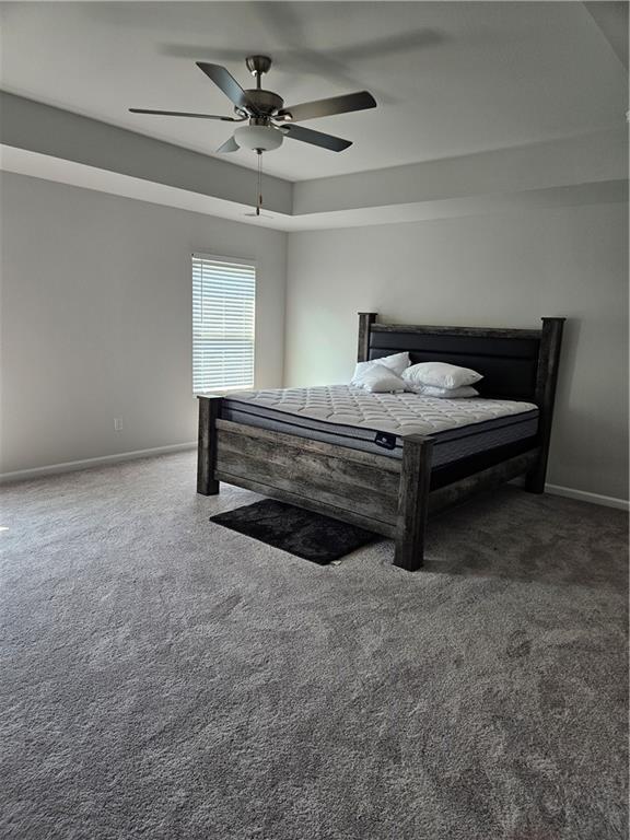 carpeted bedroom with ceiling fan