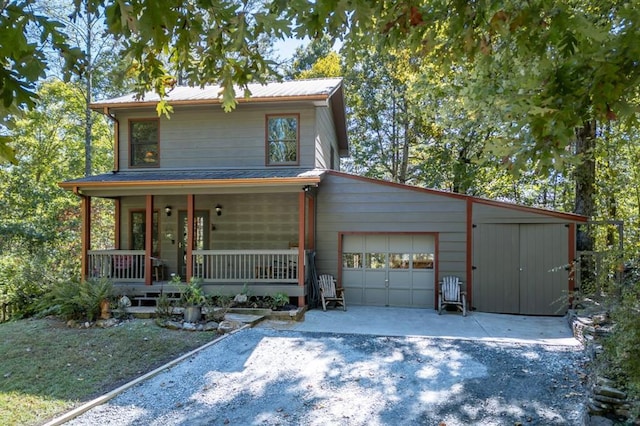 front facade with a porch and a garage