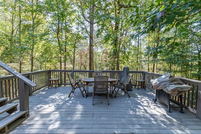 wooden terrace featuring area for grilling