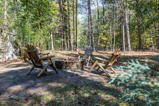 view of yard featuring a patio area and a fire pit