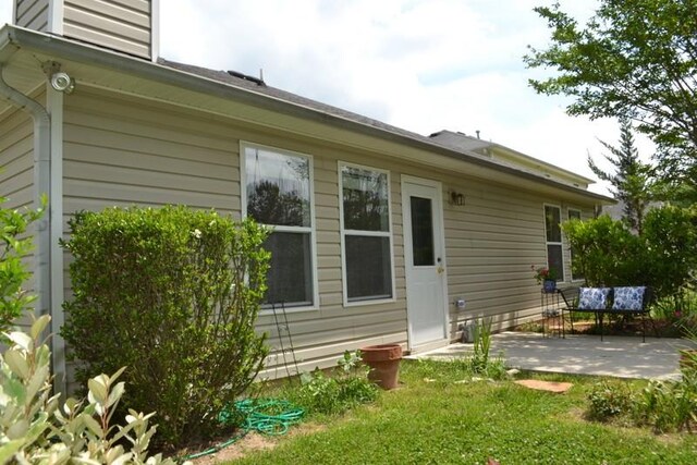 back of property featuring a patio area