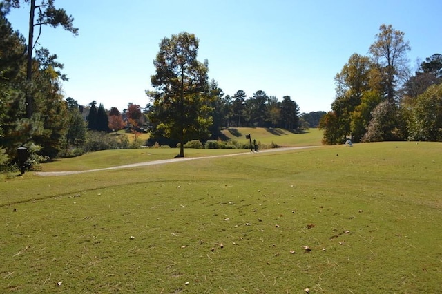 surrounding community featuring a lawn