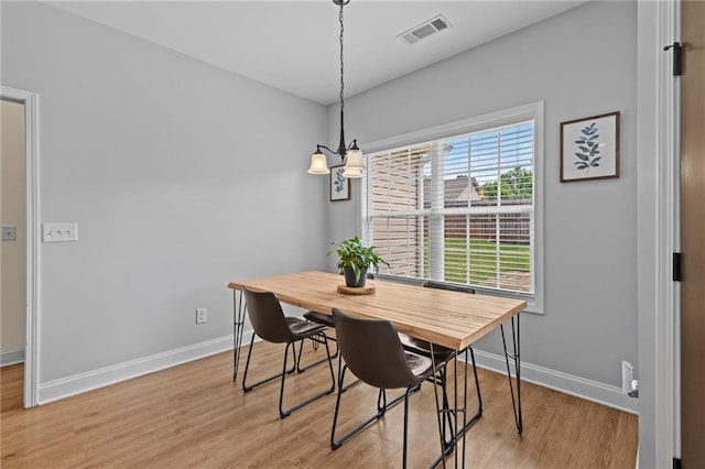 419 Highland Pointe Dr, Alto, GA 30510 - dining room featuring light wood-type flooring, baseboards, and a chandelier