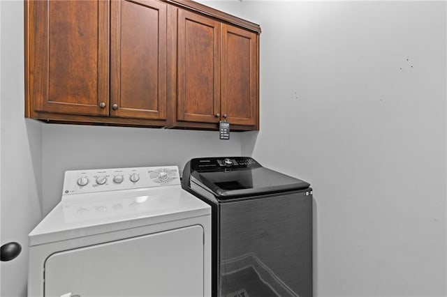 419 Highland Pointe Dr, Alto, GA 30510 - laundry room featuring washing machine and clothes dryer and cabinet space