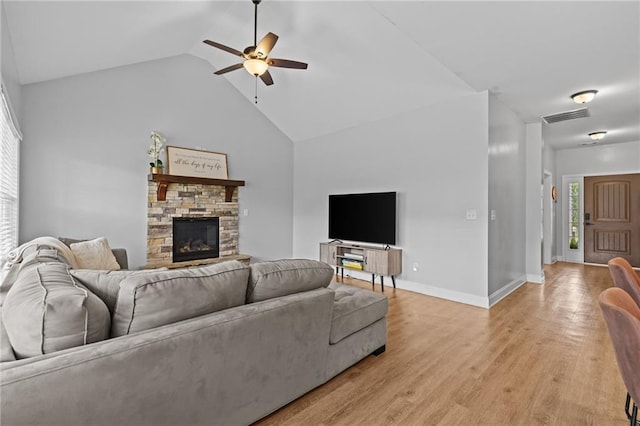 419 Highland Pointe Dr, Alto, GA 30510 - living room featuring ceiling fan, a fireplace, light wood-style flooring, baseboards, and high vaulted ceiling