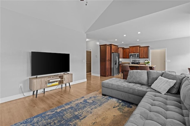 419 Highland Pointe Dr, Alto, GA 30510 - living room featuring recessed lighting, light wood finished floors, baseboards, and high vaulted ceiling