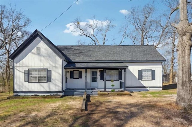 5119 NE Worsham St, Covington, GA 30014 - view of front of home with roof with shingles, covered porch, and board and batten siding
