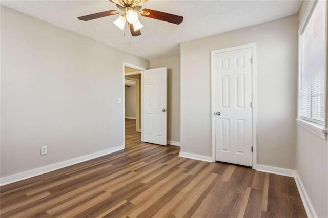 5119 NE Worsham St, Covington, GA 30014 - unfurnished bedroom with wood finished floors and ceiling fan
