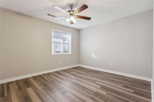 5119 NE Worsham St, Covington, GA 30014 - empty room with wood finished floors, ceiling fan, and a textured ceiling