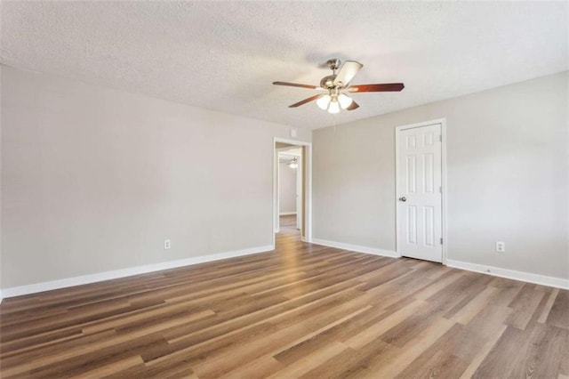 5119 NE Worsham St, Covington, GA 30014 - empty room with ceiling fan, wood finished floors, and a textured ceiling