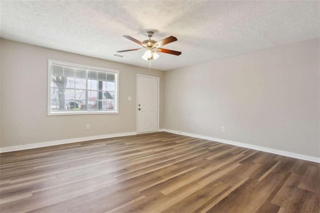 5119 NE Worsham St, Covington, GA 30014 - unfurnished room featuring a textured ceiling, ceiling fan, and wood finished floors