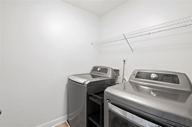 laundry room featuring independent washer and dryer