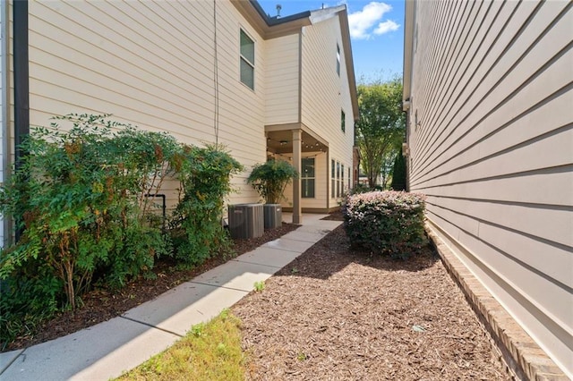 view of side of property with central AC