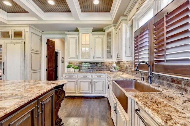 kitchen with ornamental molding, beamed ceiling, and backsplash