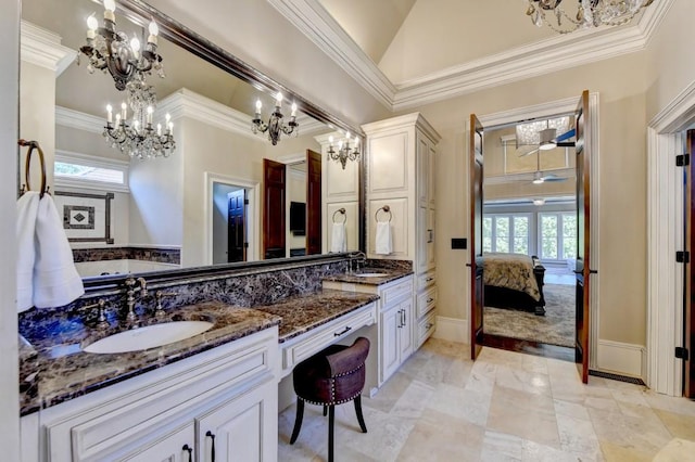 ensuite bathroom featuring a sink, crown molding, double vanity, and connected bathroom