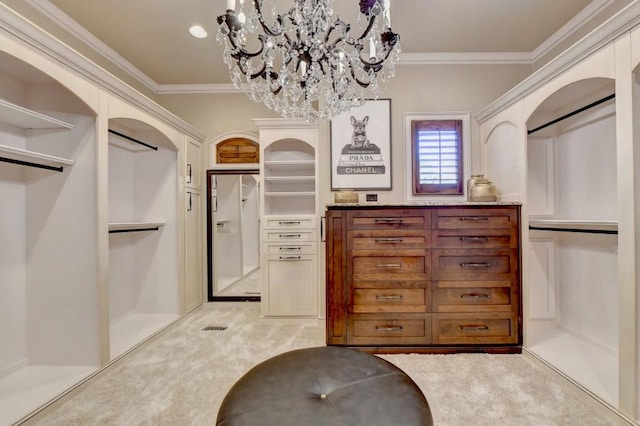 bathroom with crown molding and a notable chandelier