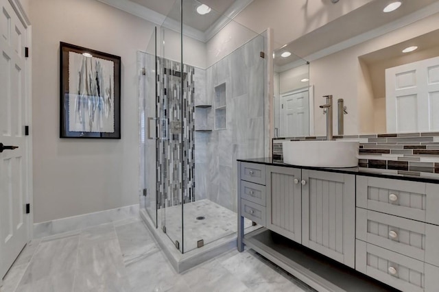 bathroom with backsplash, a stall shower, vanity, baseboards, and marble finish floor