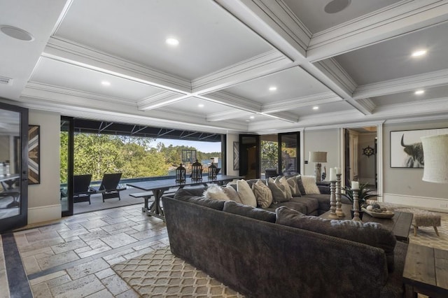 living room featuring ornamental molding, coffered ceiling, recessed lighting, and stone tile floors