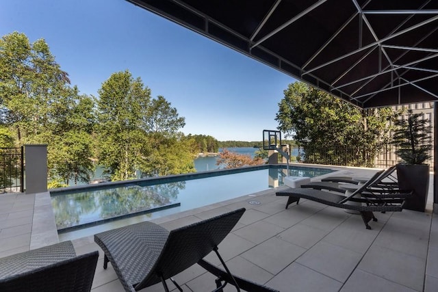 view of pool with a water view, an infinity pool, and a patio area