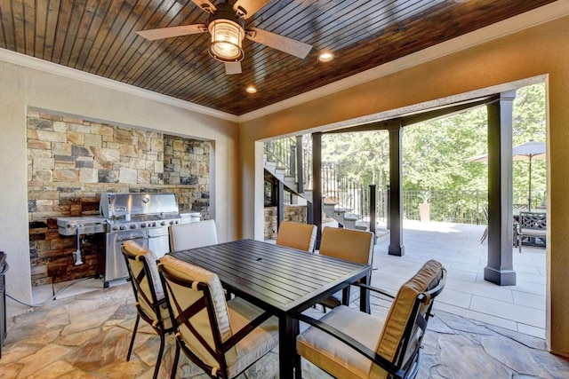 dining room featuring ornamental molding, stairs, ceiling fan, stone finish floor, and wood ceiling