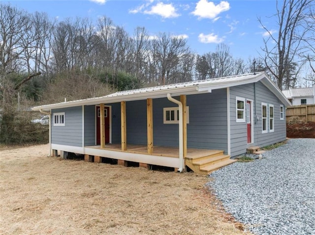 view of front of house featuring a porch and metal roof