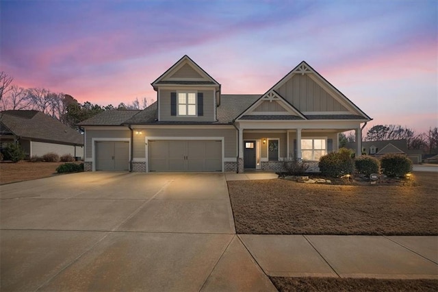 view of front of property with a garage and a porch