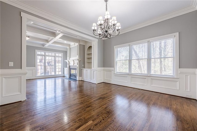 interior space with a fireplace with flush hearth, beam ceiling, built in features, coffered ceiling, and dark wood-style floors