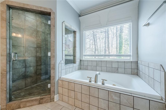 full bathroom featuring a bath, tile patterned floors, a stall shower, and crown molding