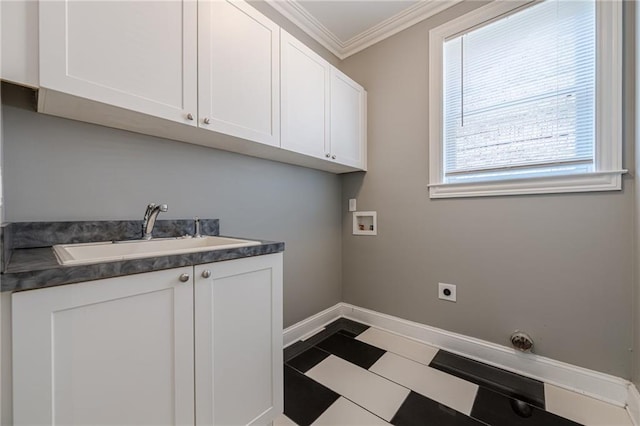 laundry room featuring baseboards, ornamental molding, hookup for a washing machine, cabinet space, and a sink