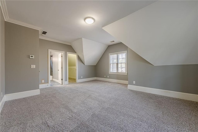 bonus room featuring light carpet, visible vents, lofted ceiling, and baseboards