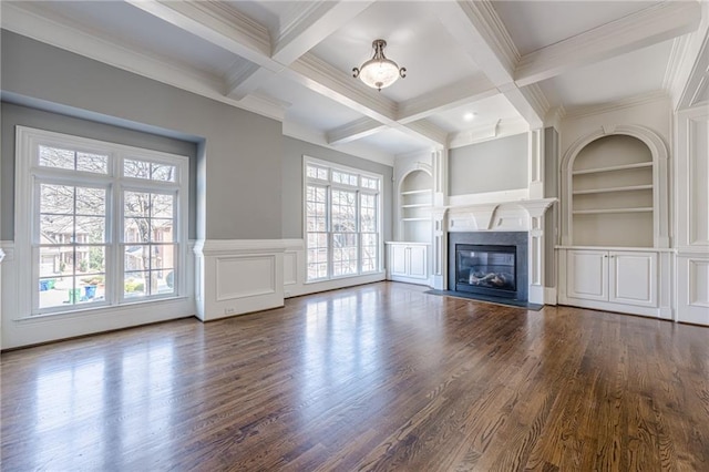 unfurnished living room featuring beam ceiling, a fireplace with flush hearth, built in shelves, and dark wood-style flooring