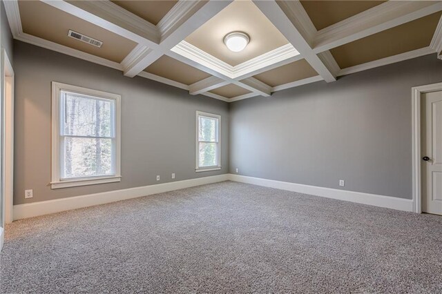 spare room featuring beamed ceiling, coffered ceiling, and carpet floors