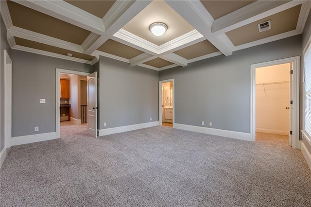 unfurnished bedroom featuring visible vents, coffered ceiling, and light carpet